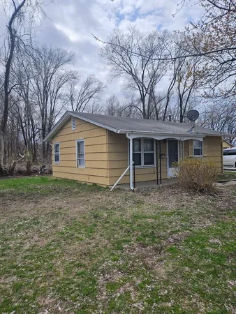 a house view with a backyard space