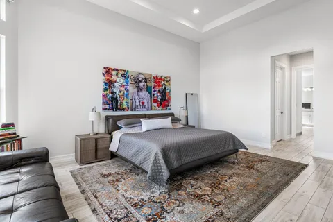 a bedroom with a bed and a couch