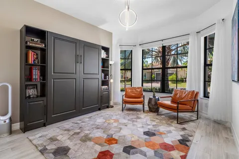 a bedroom with furniture and a window