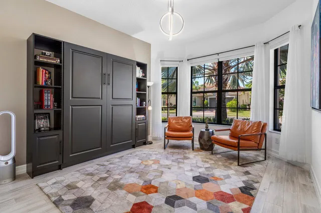 a bedroom with furniture and a window