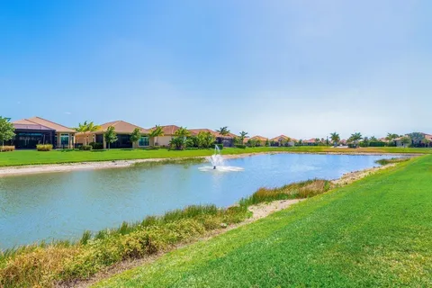 a view of a lake with houses in the back