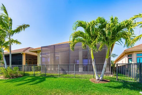 a view of a house with a yard and a garden