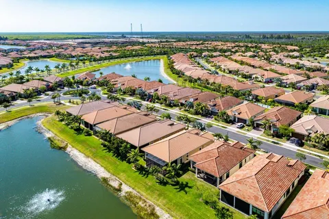 an aerial view of a city with a lake view
