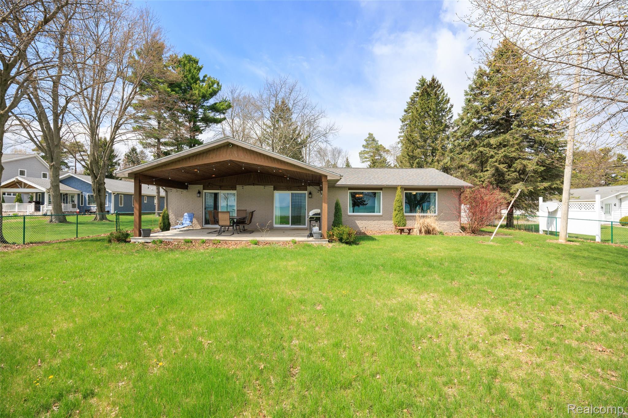 Back of house featuring a patio area and brick siding