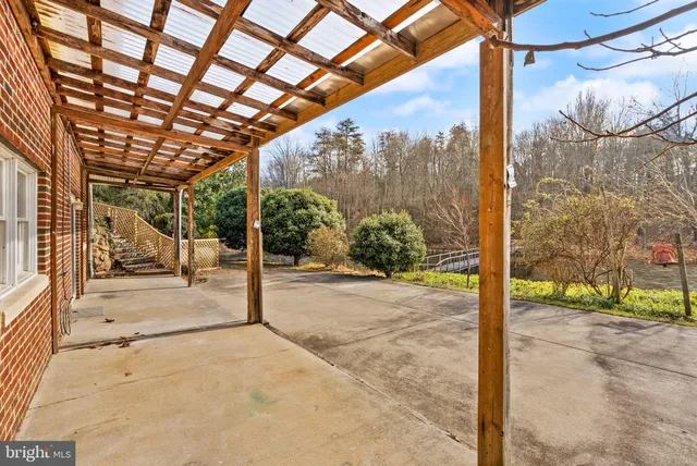 a spacious bedroom with a bed and a view of bedroom