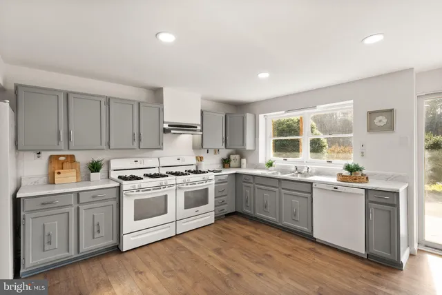 a view of a livingroom with furniture and a fireplace