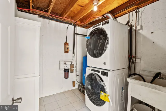 a view of a dining room with furniture and a window
