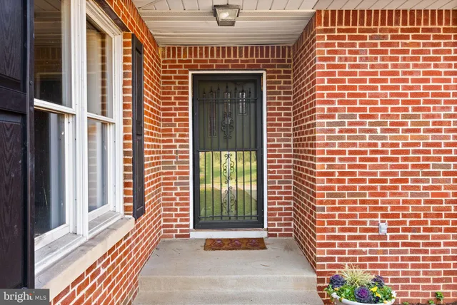 a bathroom with a granite countertop sink mirror and a bathtub