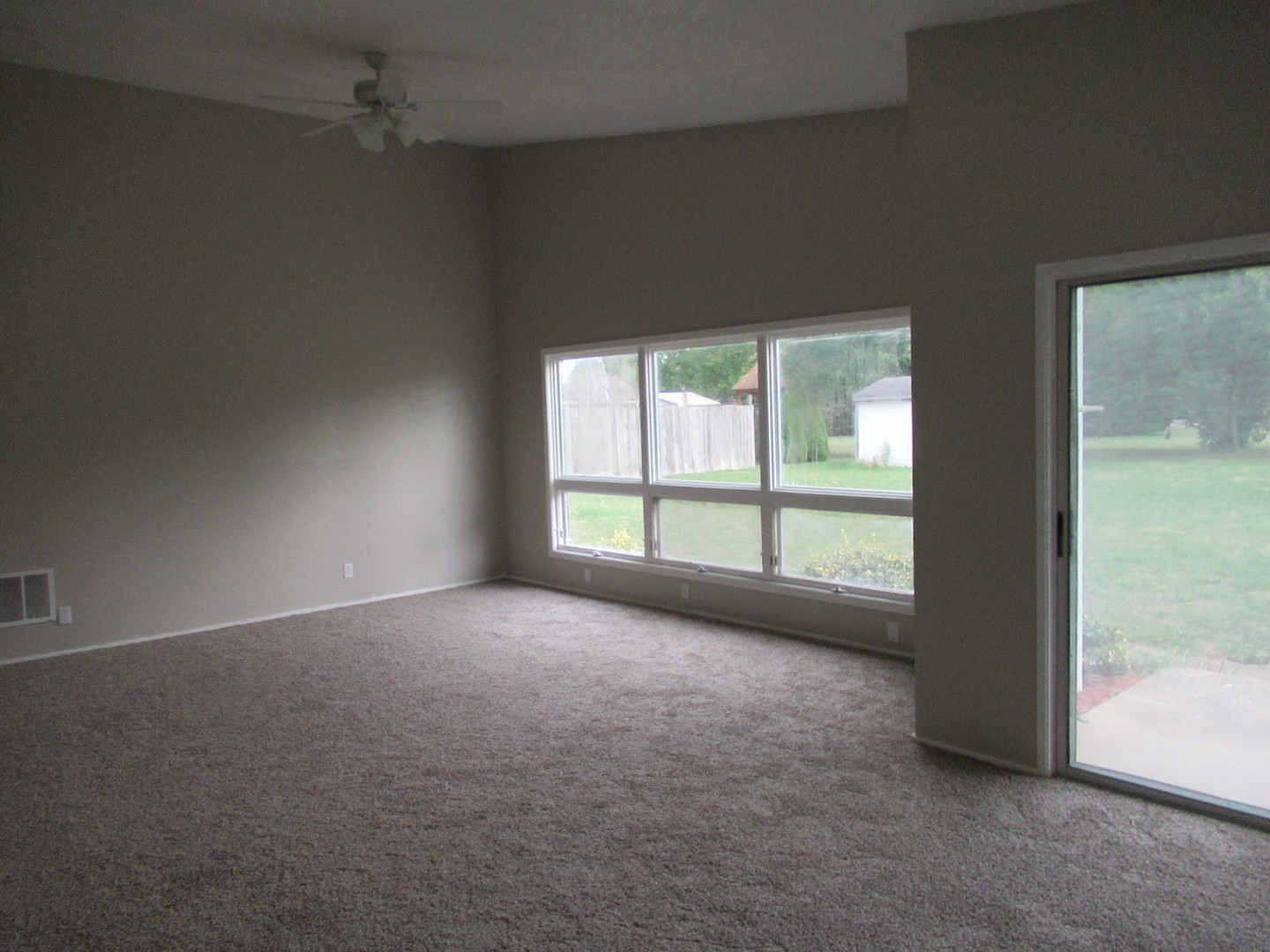 1563 South Pointe Drive Rantoul, IL 61866 - Photo 6 of 15 an empty room with a empty space and windows