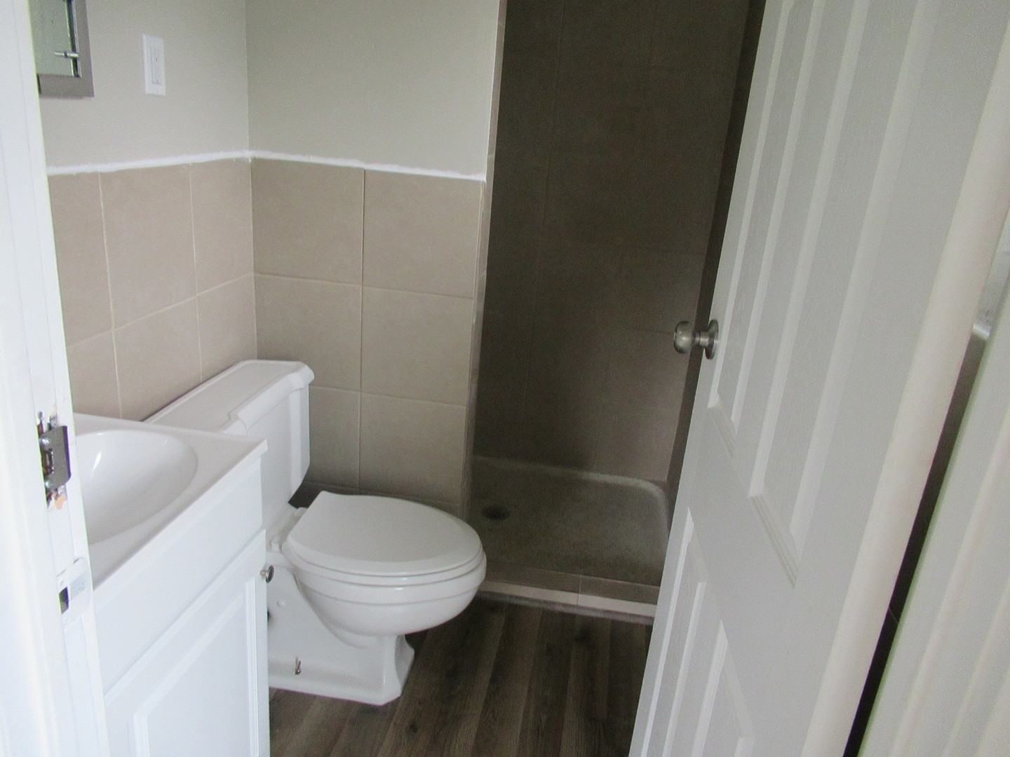 1563 South Pointe Drive Rantoul, IL 61866 - Photo 10 of 15 a white toilet sitting next to a white sink
