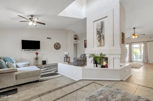 a dining room with furniture and a flat screen tv
