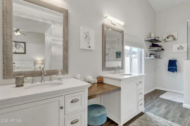 a en suite bathroom with a sink and a mirror