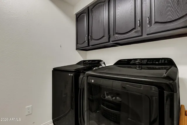 a view of a patio with a table and chairs