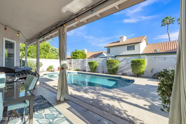 a view of a backyard with sitting area