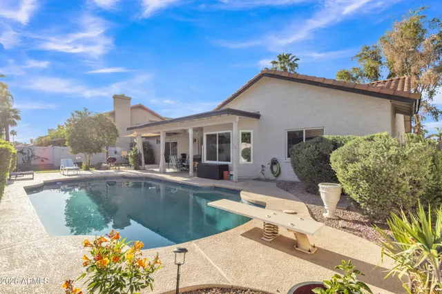 a view of a house with a swimming pool