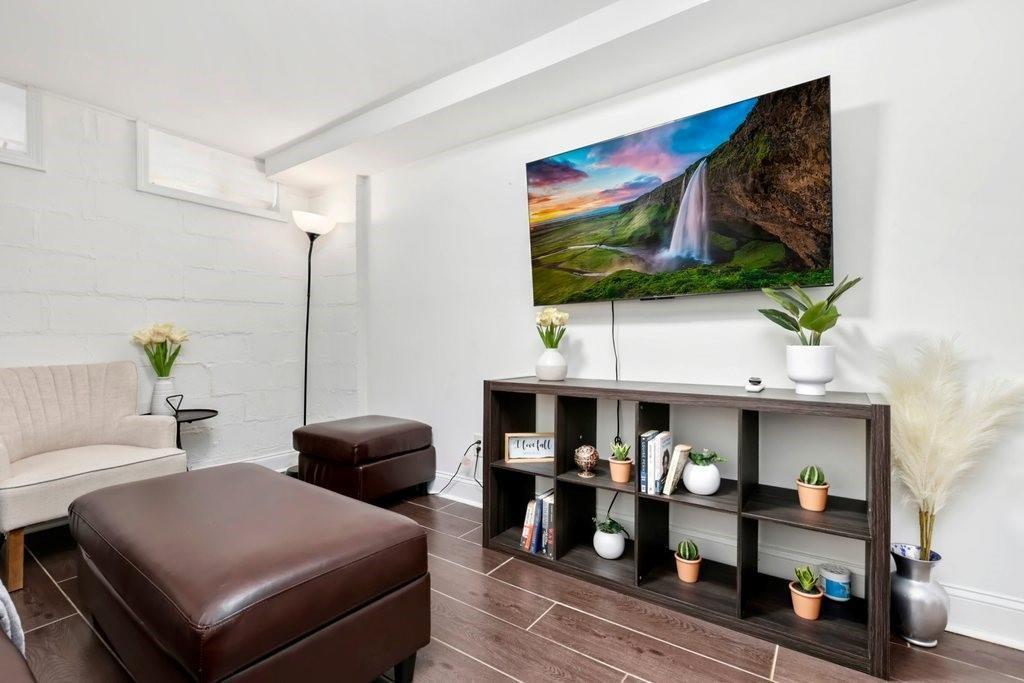 677 Holmes Street Northwest Atlanta, GA 30318 - Photo 17 of 31 a living room with furniture and a flat screen tv