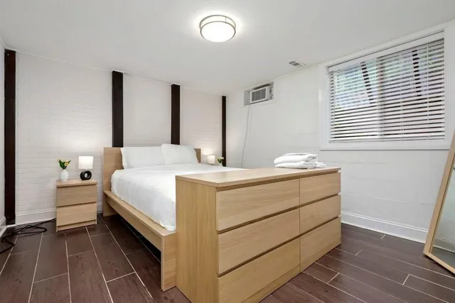 a room with a bed and a window