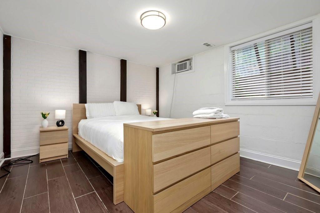 677 Holmes Street Northwest Atlanta, GA 30318 - Photo 21 of 31 a room with a bed and a window