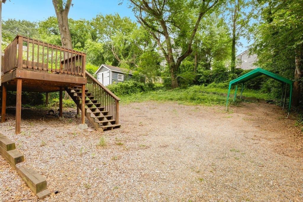 677 Holmes Street Northwest Atlanta, GA 30318 - Photo 28 of 31 a view of a deck with a yard