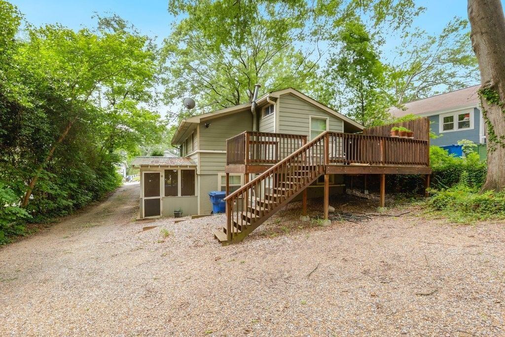 677 Holmes Street Northwest Atlanta, GA 30318 - Photo 29 of 31 a view of a house with a yard and sitting area