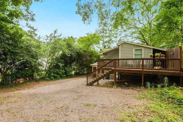 a house with trees in the background