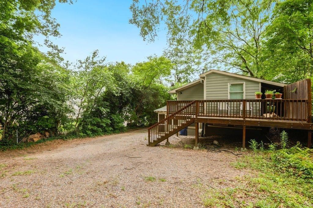 677 Holmes Street Northwest Atlanta, GA 30318 - Photo 30 of 31 a house with trees in the background
