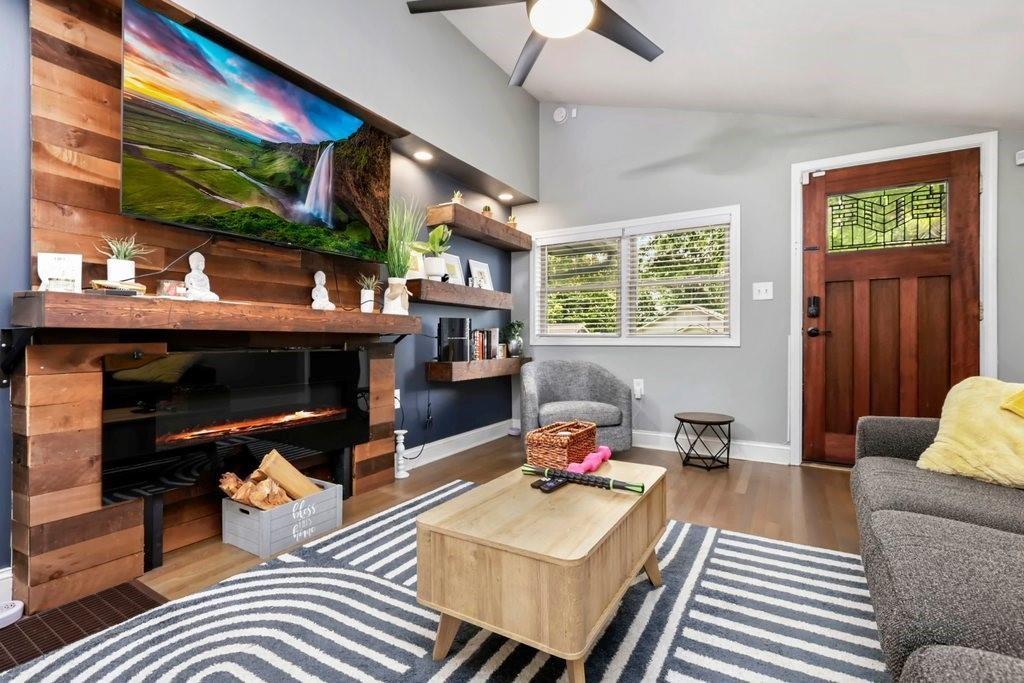 677 Holmes Street Northwest Atlanta, GA 30318 - Photo 4 of 31 a living room with furniture and a fireplace