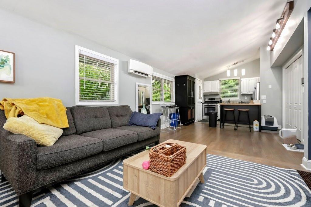 677 Holmes Street Northwest Atlanta, GA 30318 - Photo 5 of 31 a living room with furniture and wooden floor