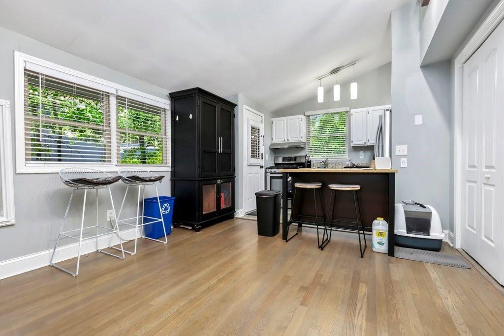 677 Holmes Street Northwest Atlanta, GA 30318 - Photo 7 of 31 a view of a workspace with furniture and a window