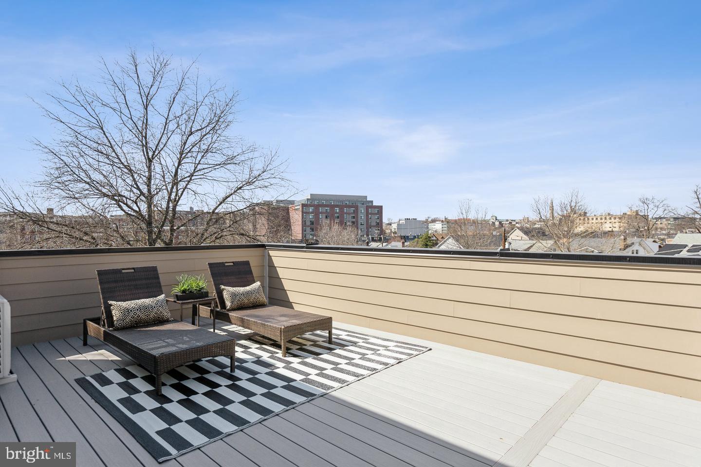 1016 Rhode Island Avenue Northeast, Unit 7 Washington, DC 20018 - Photo 14 of 18 a view of a terrace with wooden bench and trees