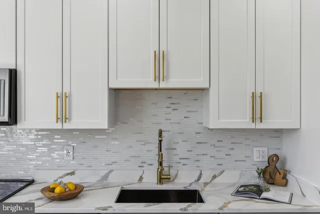 a kitchen with a sink and cabinets