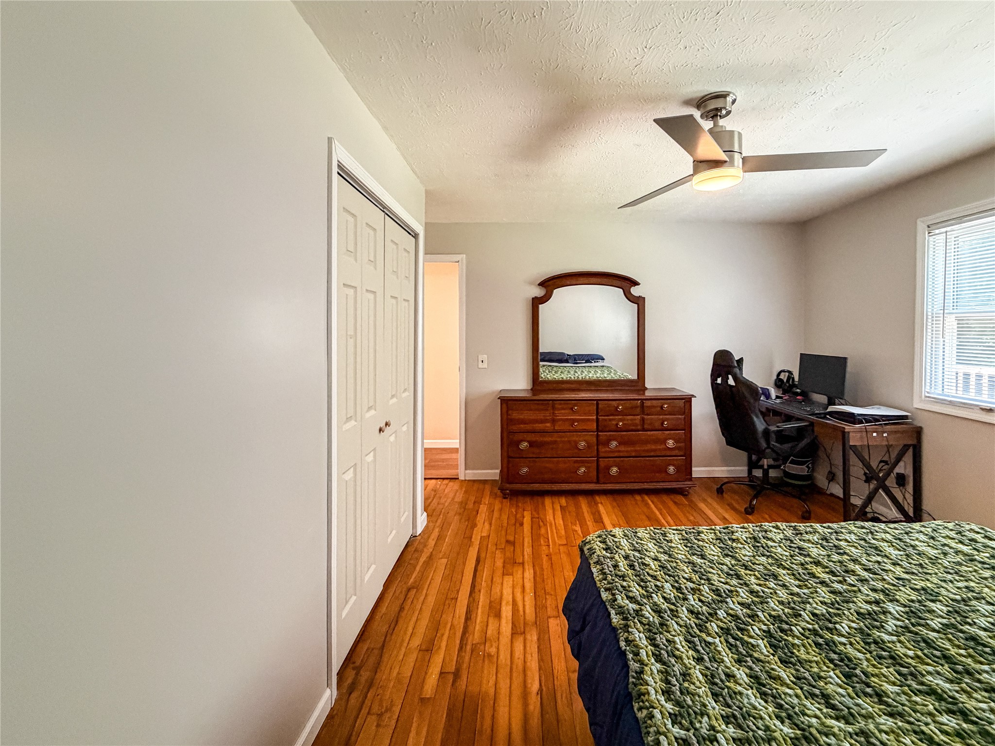 11910 Schenenberg Road Guys Mills, PA 16327 - Photo 33 of 50 Bed 2 with ceiling fan and hardwood floors