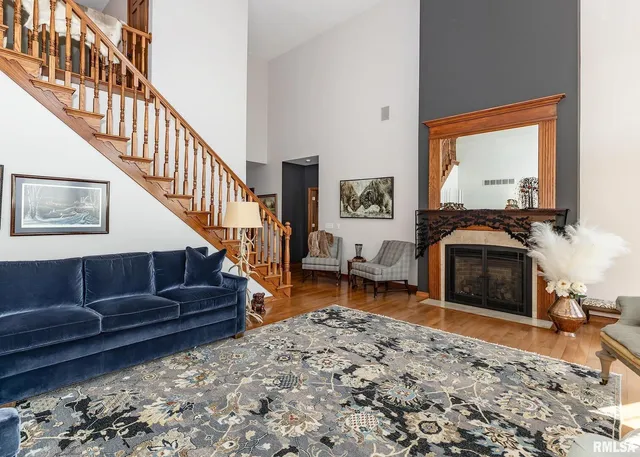 a room with wooden floors and stairs