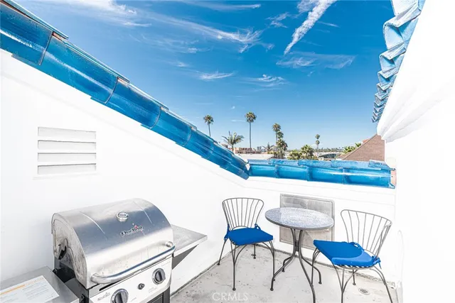 a view of kitchen with furniture and a potted plant