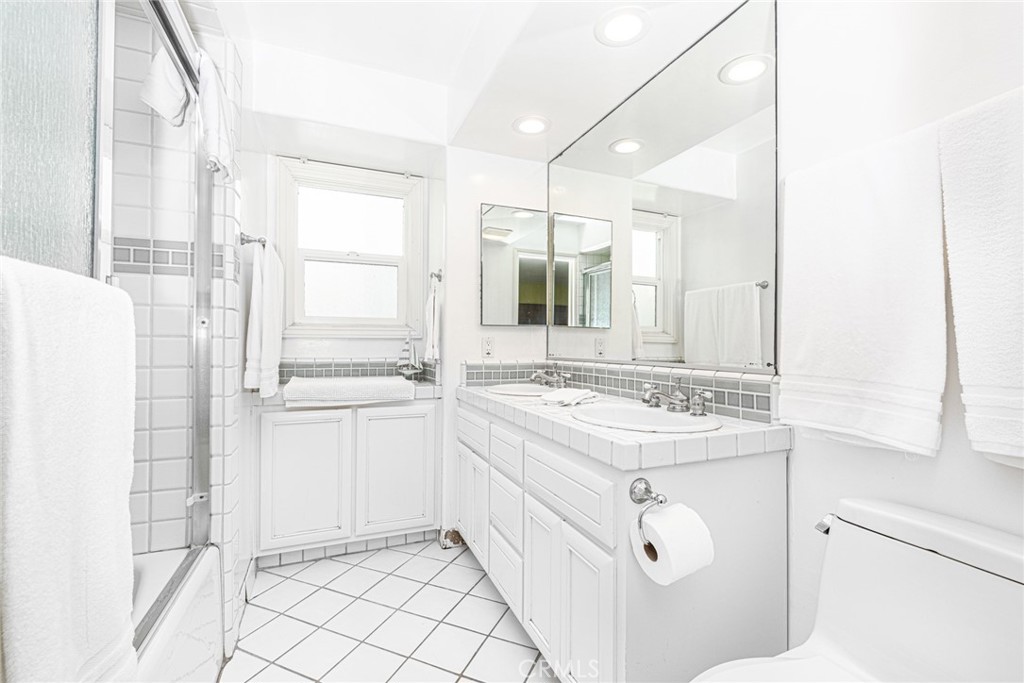 1720 West Oceanfront, Unit B Newport Beach, CA 92663 - Photo 10 of 28 a bathroom with a sink and a mirror