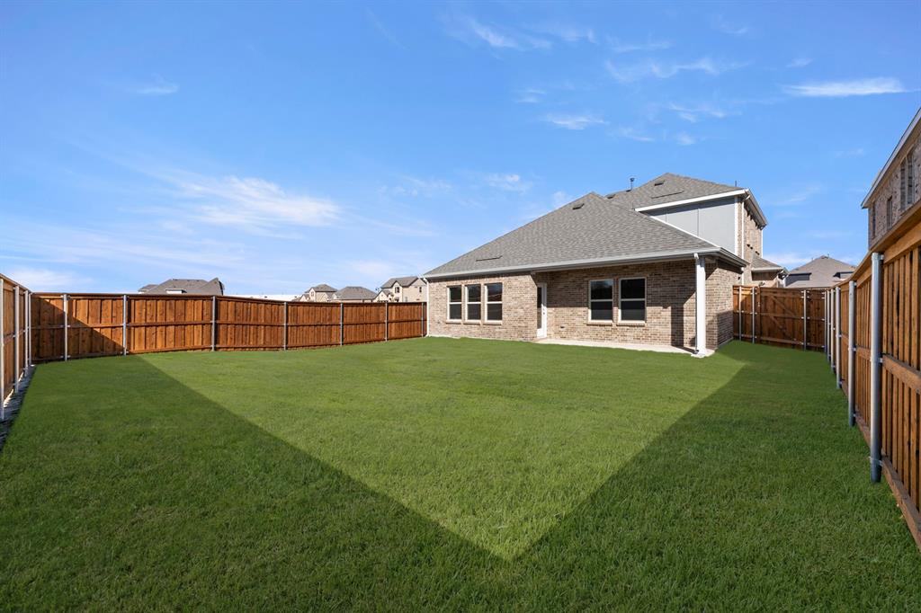 2359 Bell Way Forney, TX 75126 - Photo 31 of 31 a front view of a house with a garden