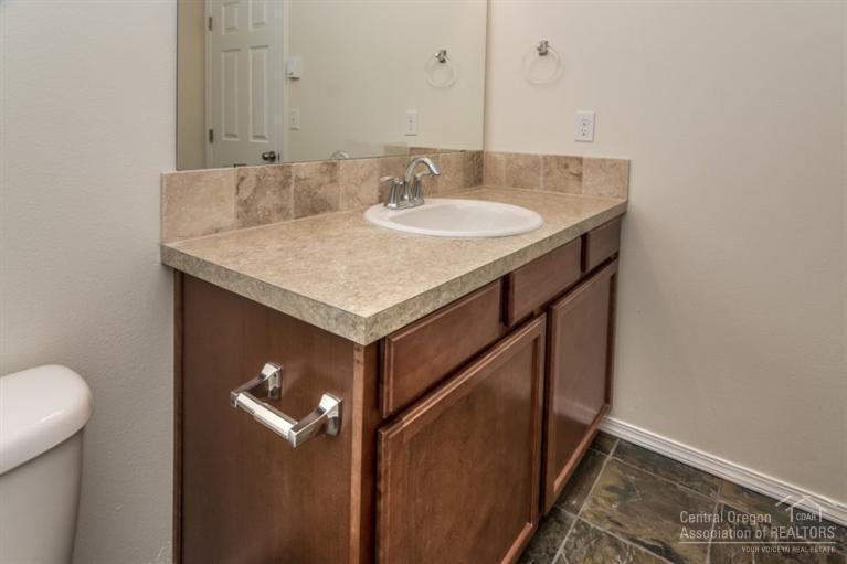 17306 Kingsburg Road Bend, OR 97707 - Photo 13 of 22 a bathroom with a sink and mirror