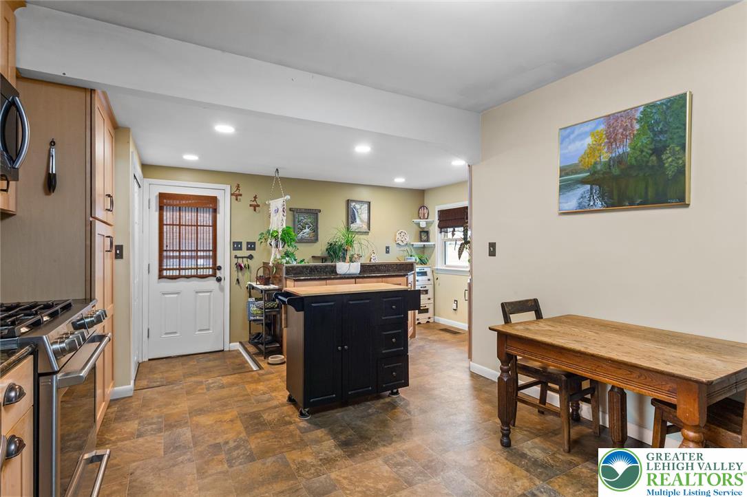254 Old Allentown Road Wind Gap, PA 18091 - Photo 6 of 20 a kitchen with stainless steel appliances granite countertop a refrigerator and a stove top oven