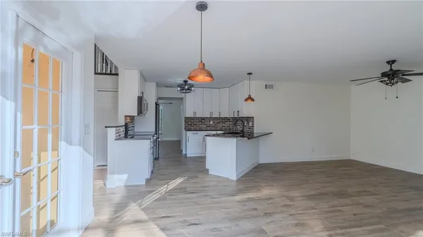 a room that has a window and kitchen view