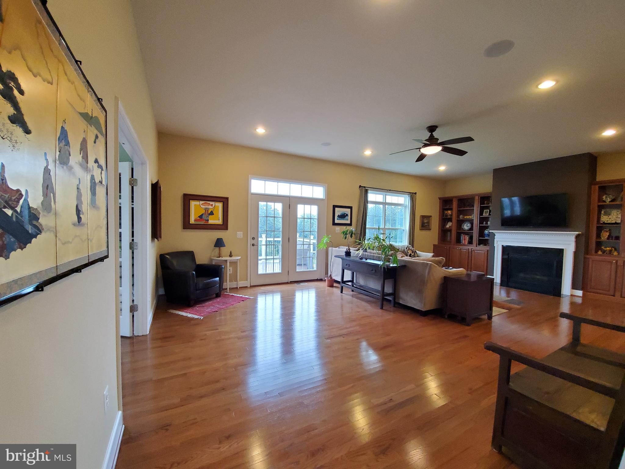 41882 Scotchbridge Place Ashburn, VA 20148 - Photo 11 of 89 Grand family room with built-ins & gas fireplace.