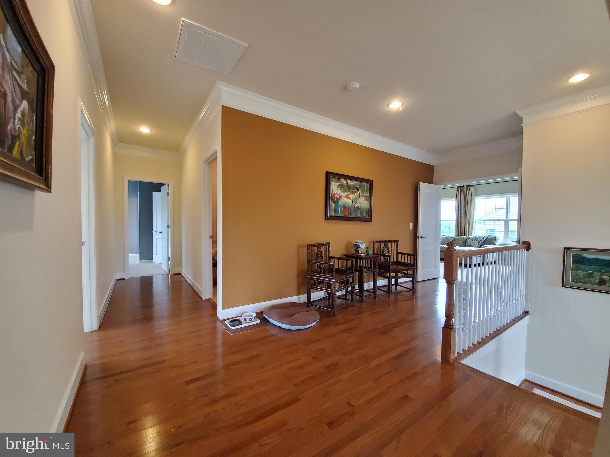 41882 Scotchbridge Place Ashburn, VA 20148 - Photo 23 of 89 Upstairs hallway with hardwood floors.