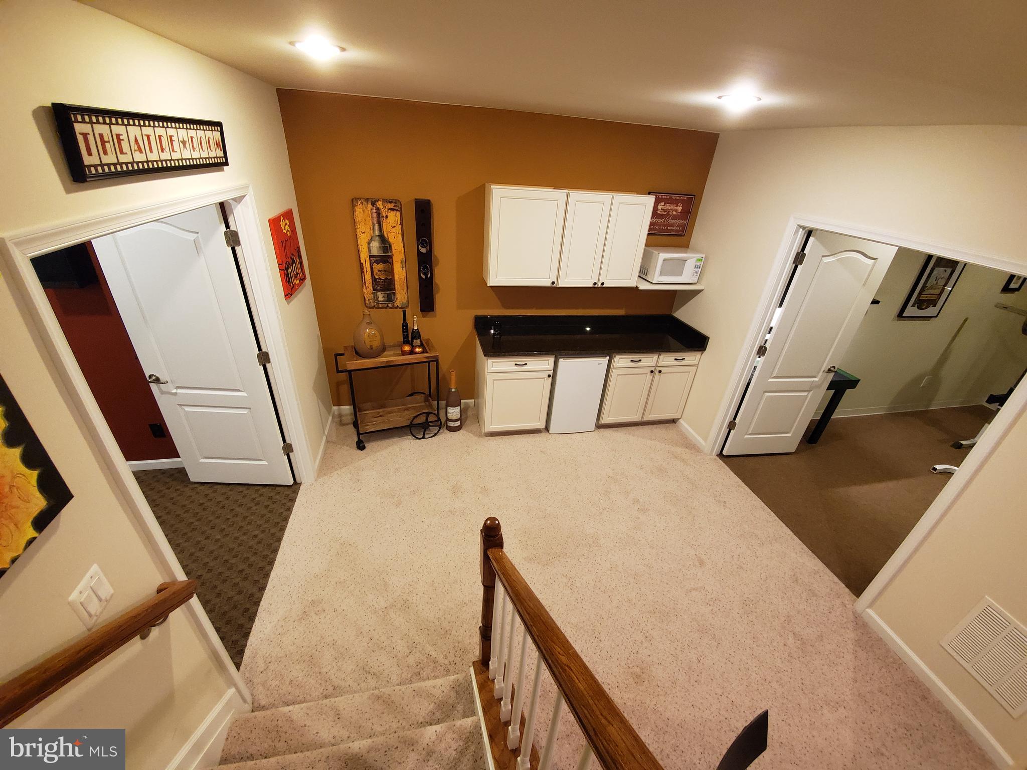 41882 Scotchbridge Place Ashburn, VA 20148 - Photo 47 of 89 Theater on the left and gym on the right.