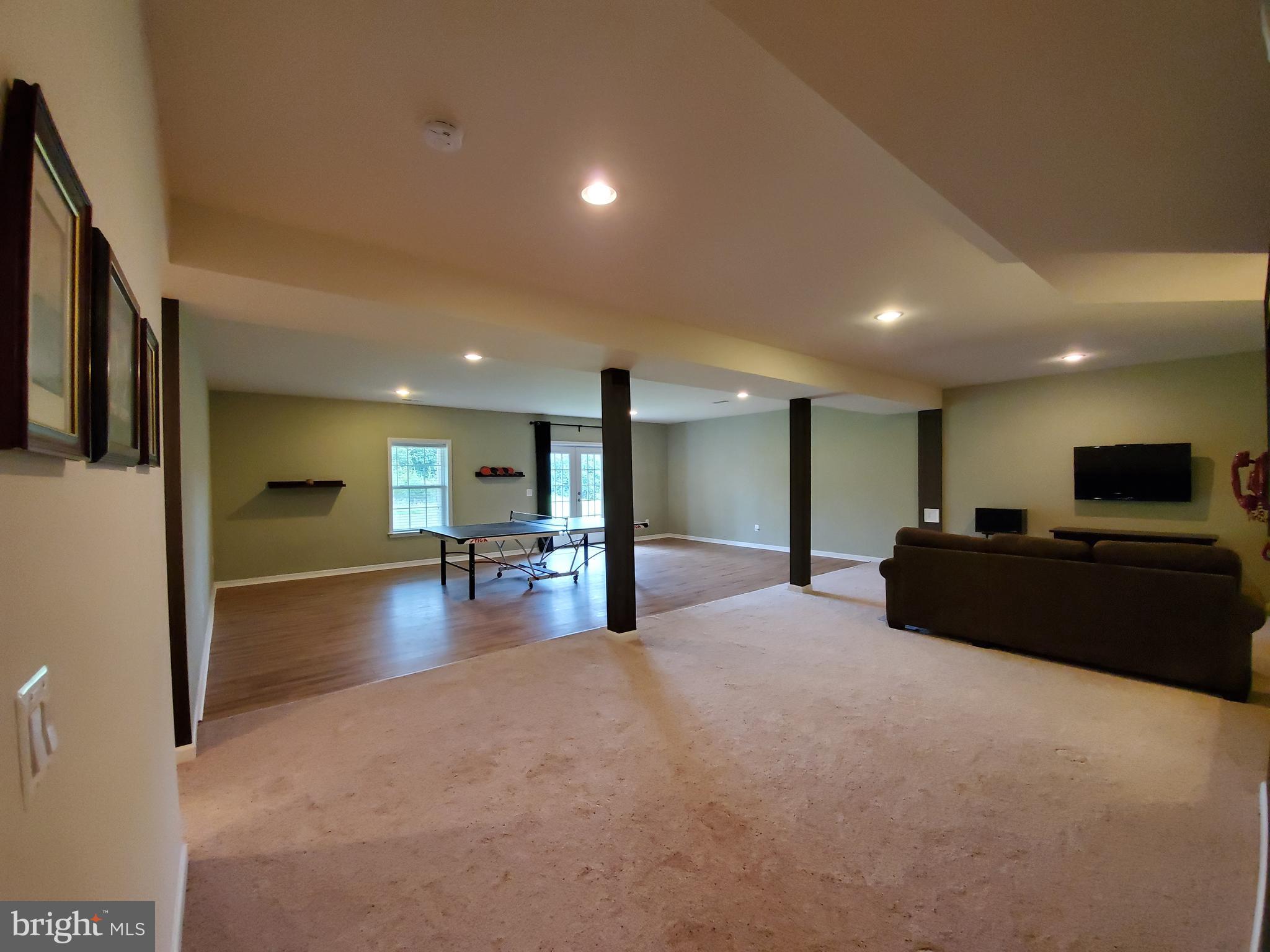 41882 Scotchbridge Place Ashburn, VA 20148 - Photo 57 of 89 Basement recroom half carpet, half resilient floor