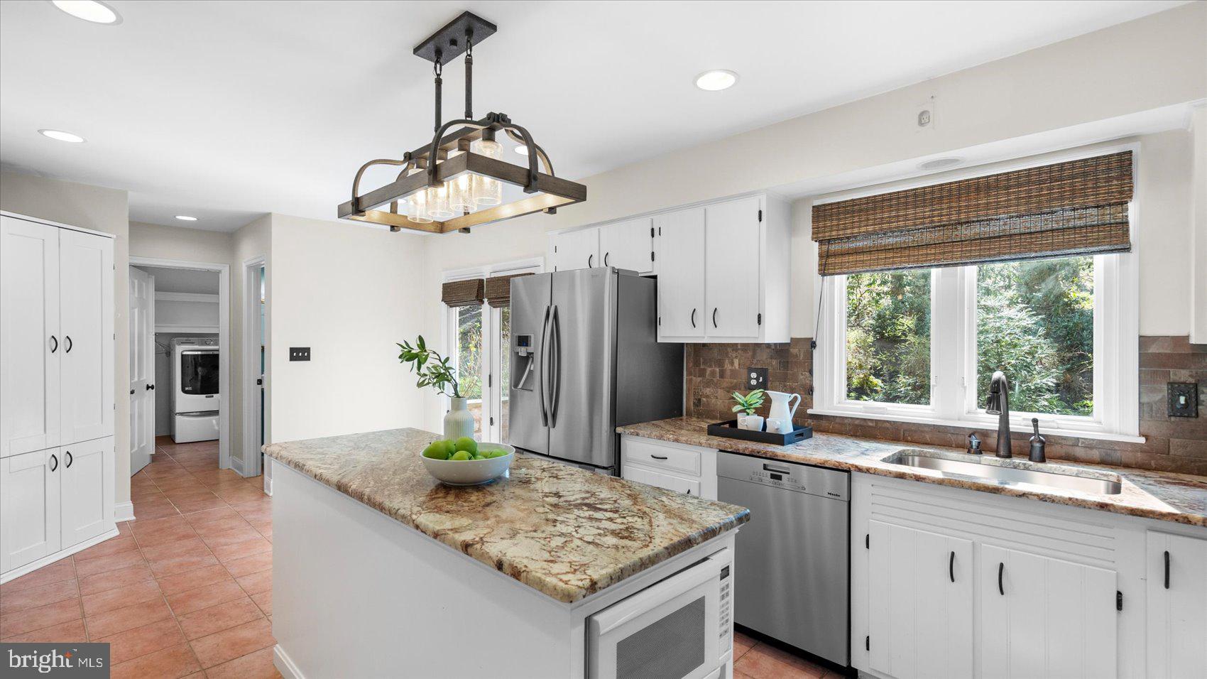 9 Nantucket Garth Phoenix, MD 21131 - Photo 12 of 52 a kitchen with stainless steel appliances granite countertop a sink stove and refrigerator