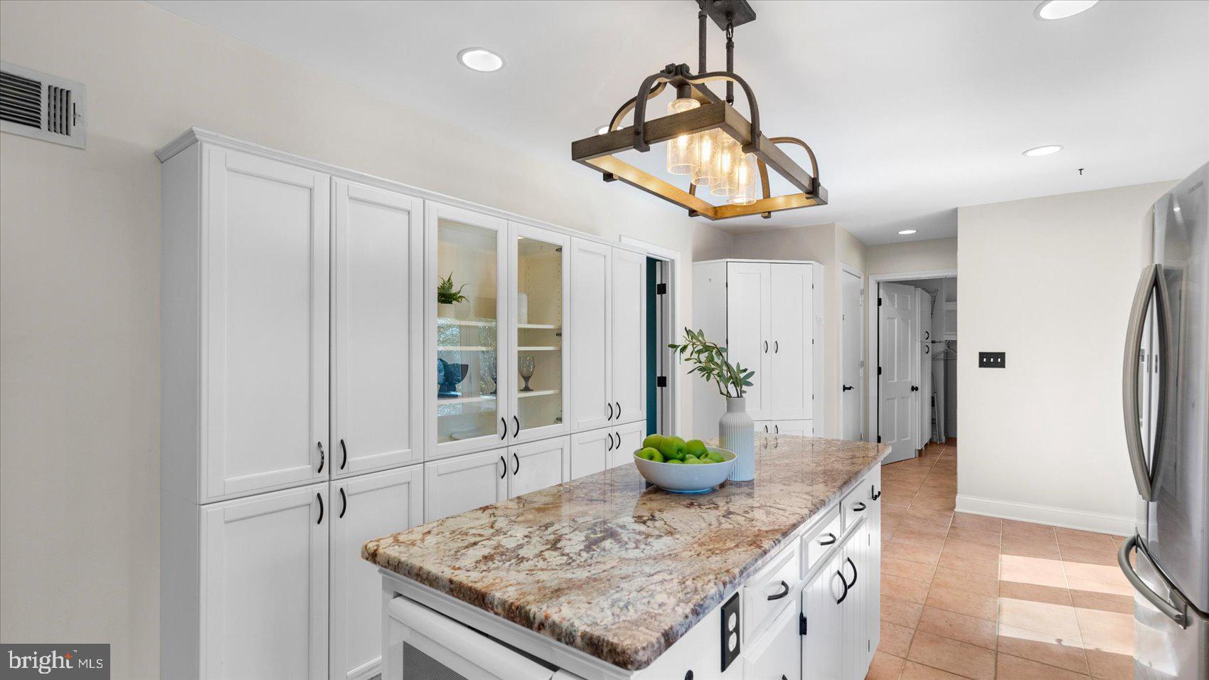 9 Nantucket Garth Phoenix, MD 21131 - Photo 14 of 52 a kitchen with stainless steel appliances granite countertop cabinets and wooden floor