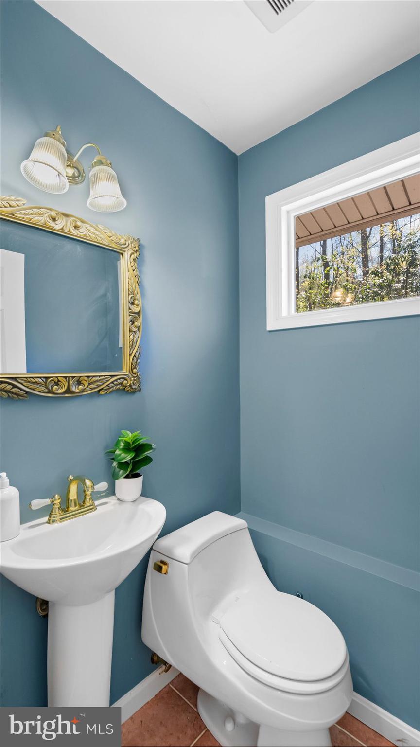 9 Nantucket Garth Phoenix, MD 21131 - Photo 20 of 52 a bathroom with a toilet sink and mirror
