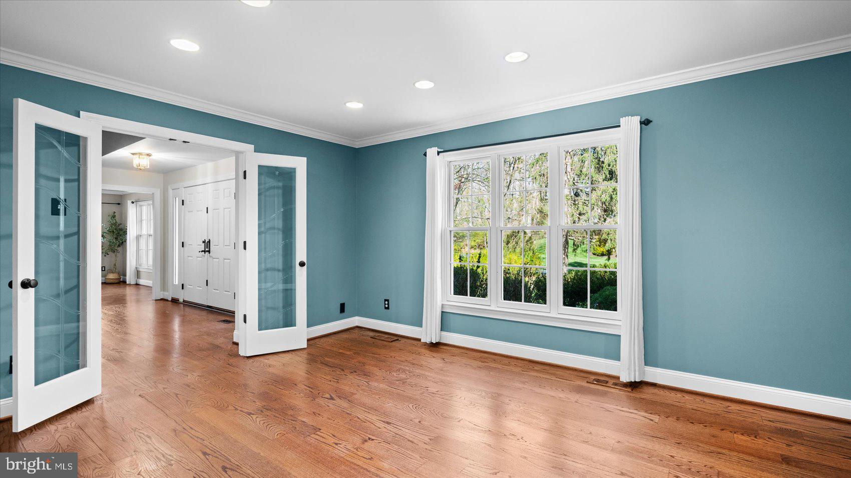 9 Nantucket Garth Phoenix, MD 21131 - Photo 22 of 52 an empty room with wooden floor and windows