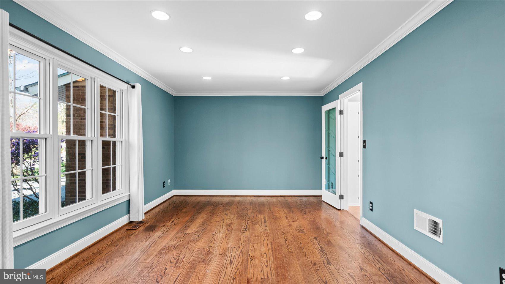 9 Nantucket Garth Phoenix, MD 21131 - Photo 23 of 52 wooden floor in an empty room with a window