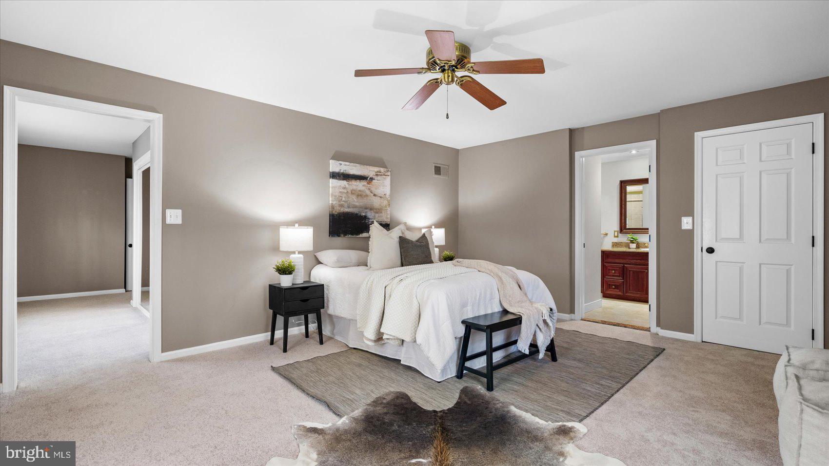 9 Nantucket Garth Phoenix, MD 21131 - Photo 24 of 52 a bed room with a bed and a chandelier