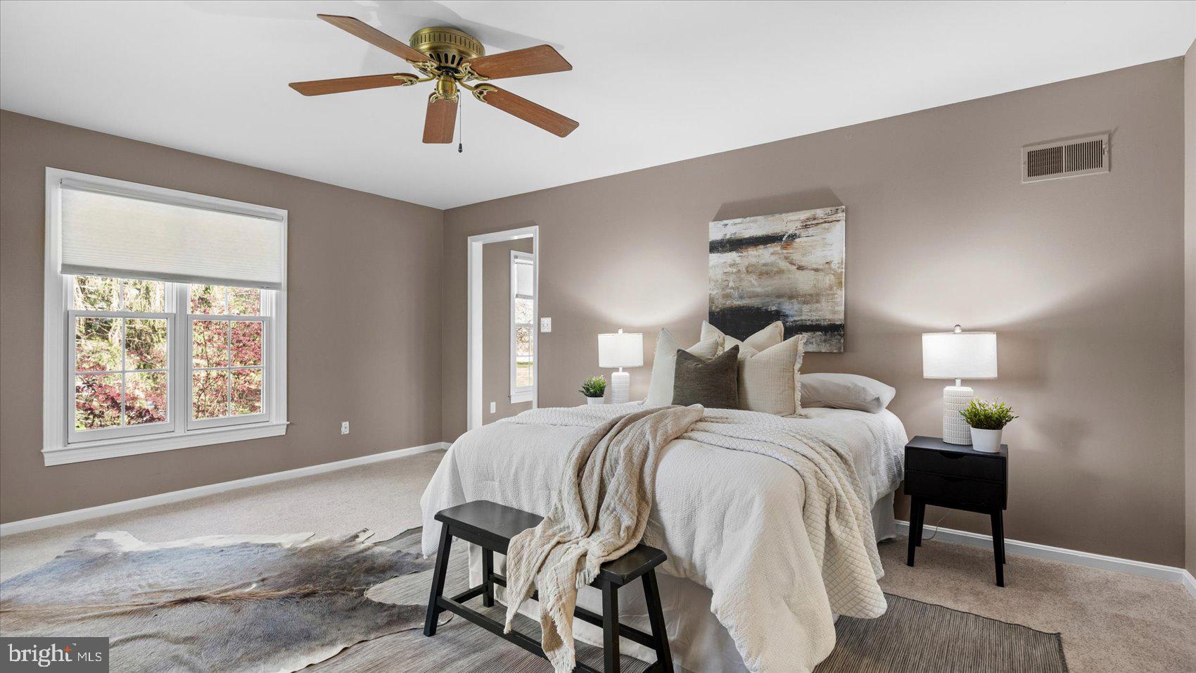 9 Nantucket Garth Phoenix, MD 21131 - Photo 26 of 52 a bedroom with a bed and a chandelier